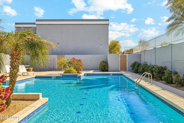 view of swimming pool featuring a fenced in pool and fence