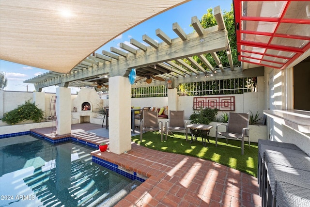 view of patio with an outdoor living space with a fireplace, a pergola, and a fenced in pool