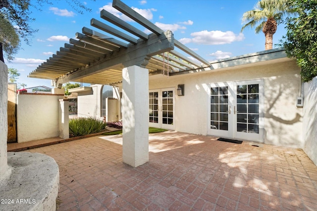 view of patio with french doors and a pergola