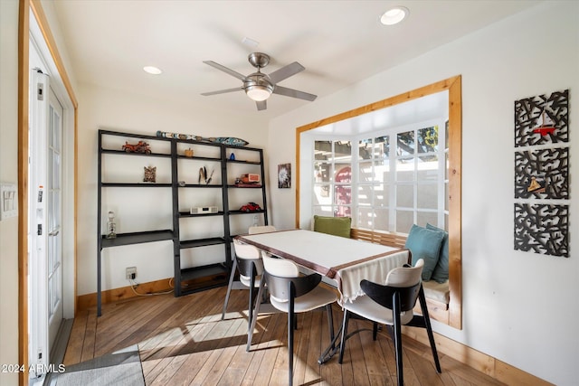 dining space featuring ceiling fan and hardwood / wood-style flooring