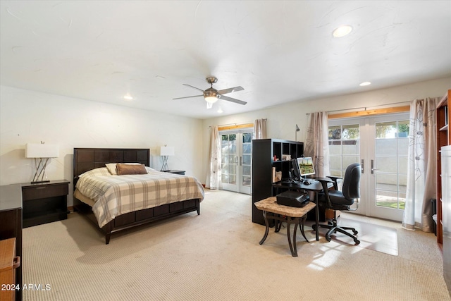 carpeted bedroom with access to exterior, french doors, multiple windows, and ceiling fan