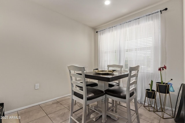 dining area featuring light tile patterned floors