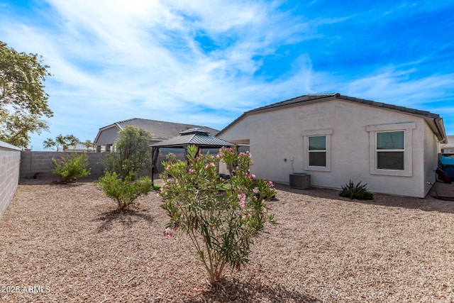 rear view of property with a gazebo