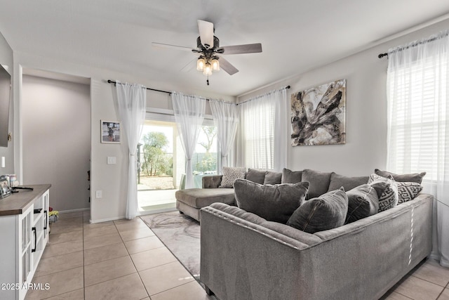 living room with light tile patterned floors and ceiling fan