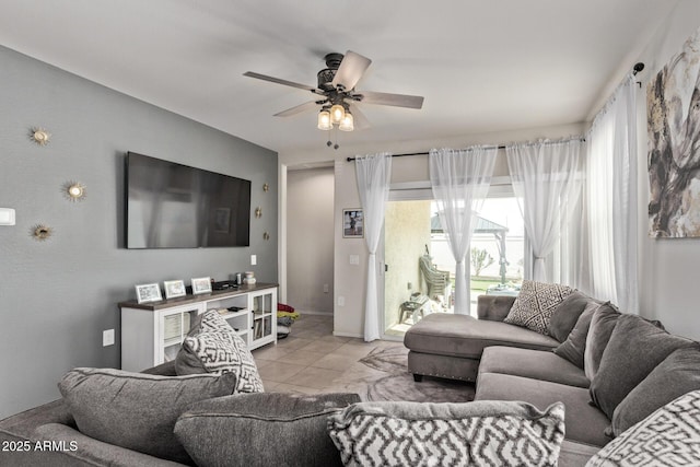 living room with light tile patterned floors and ceiling fan