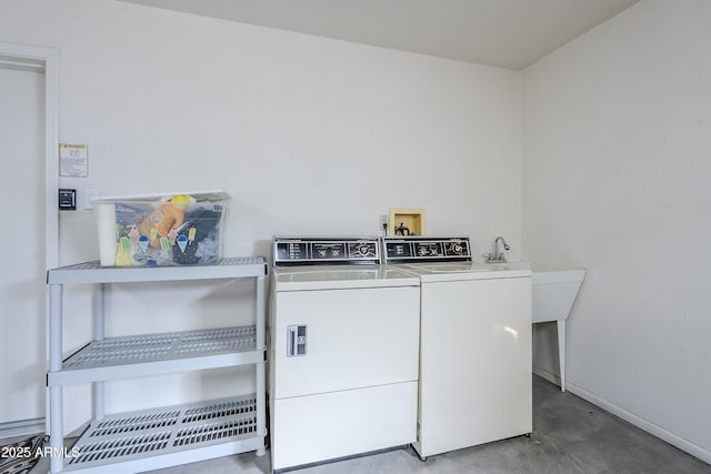 washroom featuring washer and clothes dryer