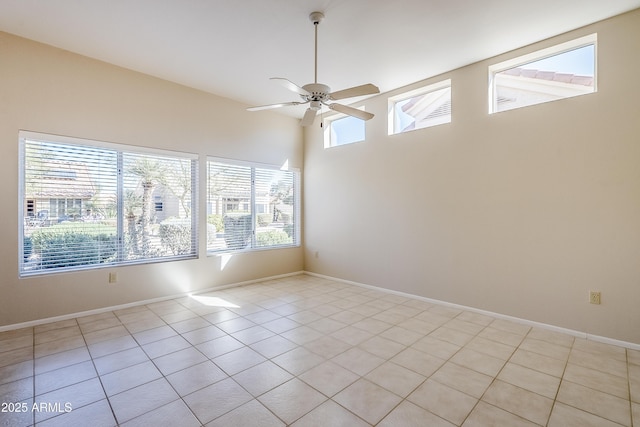 spare room featuring ceiling fan and light tile patterned flooring