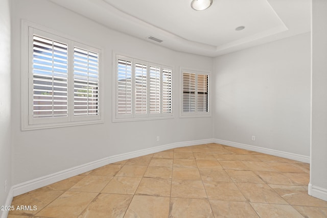 3215 E Constance Way, Phoenix, AZ 85042 - spare room featuring a raised ceiling and tile patterned flooring