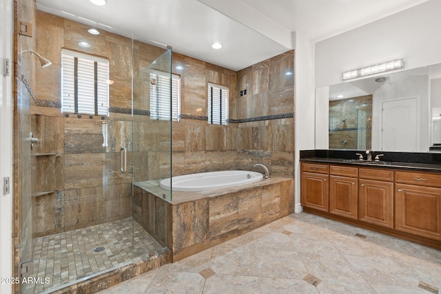 3215 E Constance Way, Phoenix, AZ 85042 - full bath with a bath, vanity, a shower stall, and recessed lighting