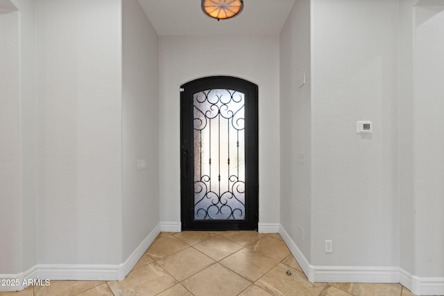 3215 E Constance Way, Phoenix, AZ 85042 - foyer with arched walkways and light tile patterned flooring