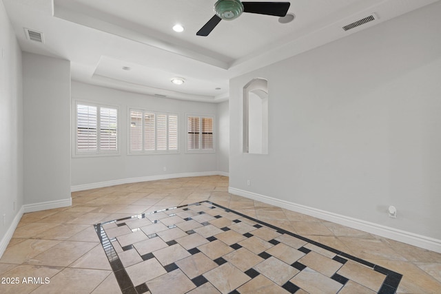 3215 E Constance Way, Phoenix, AZ 85042 - tiled empty room featuring inlaid floor details, a tray ceiling, ceiling fan, and recessed lighting