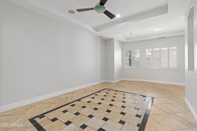 3215 E Constance Way, Phoenix, AZ 85042 - spare room featuring a tray ceiling, tile patterned floors, ceiling fan, and inlaid floor details