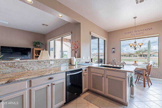 kitchen featuring visible vents, an inviting chandelier, a peninsula, a sink, and dishwasher