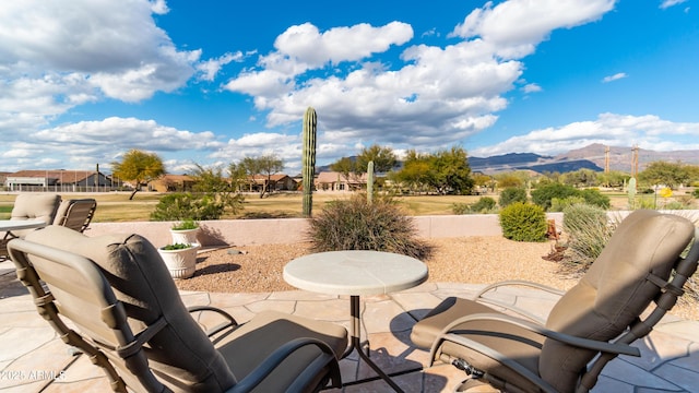 view of patio / terrace featuring a mountain view