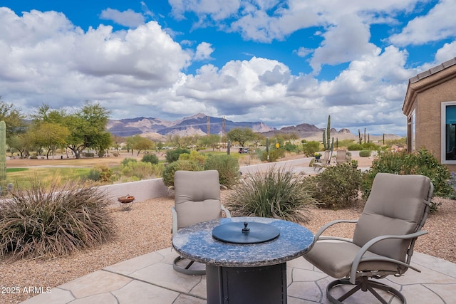 view of patio / terrace featuring a mountain view