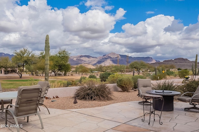 view of patio / terrace with a mountain view