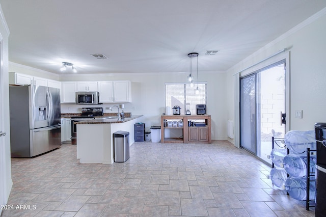 kitchen with decorative light fixtures, white cabinetry, stainless steel appliances, and ornamental molding