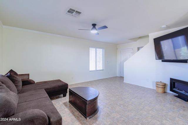 living room featuring ceiling fan and crown molding