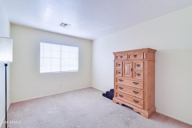 unfurnished bedroom featuring light colored carpet