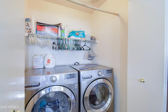 laundry area with washing machine and clothes dryer