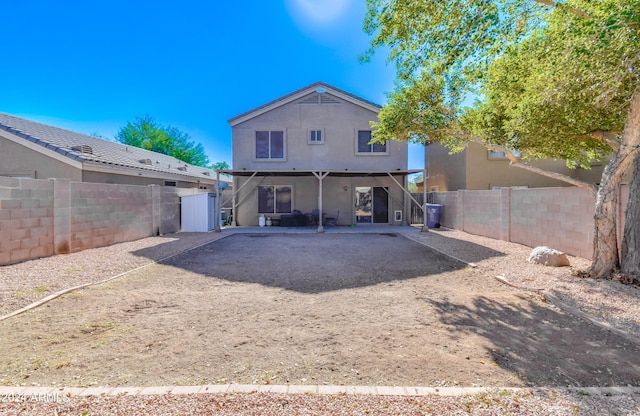 10856 E Arcadia Ave, Mesa, AZ 85208 - back of house with a fenced backyard, a patio, stucco siding, dirt driveway, and stairs