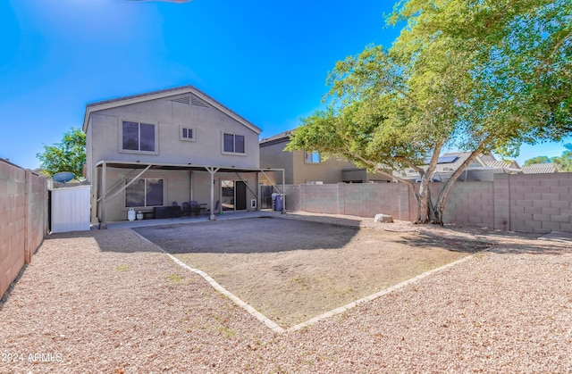 rear view of house featuring a patio area