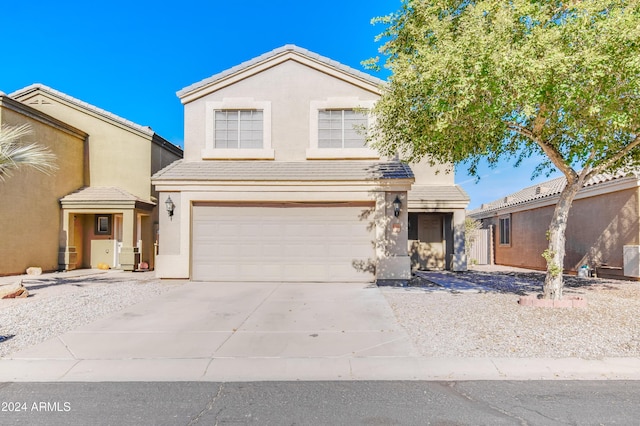 front of property with a garage