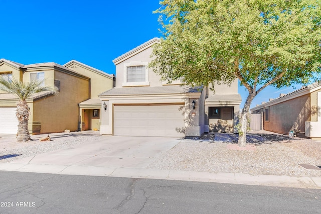 10856 E Arcadia Ave, Mesa, AZ 85208 - view of front facade with an attached garage, driveway, stucco siding, and a tile roof