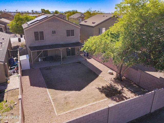 10856 E Arcadia Ave, Mesa, AZ 85208 - back of property featuring a patio area, solar panels, a fenced backyard, and a residential view