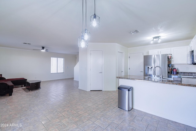 kitchen with stainless steel appliances, ceiling fan, sink, decorative light fixtures, and white cabinets