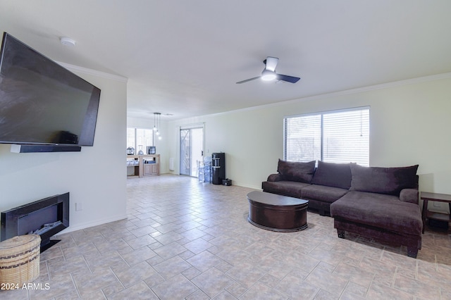 living room featuring ceiling fan and ornamental molding