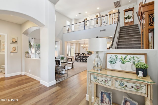 entryway with plenty of natural light, wood finished floors, and visible vents