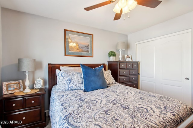 bedroom featuring ceiling fan and a closet