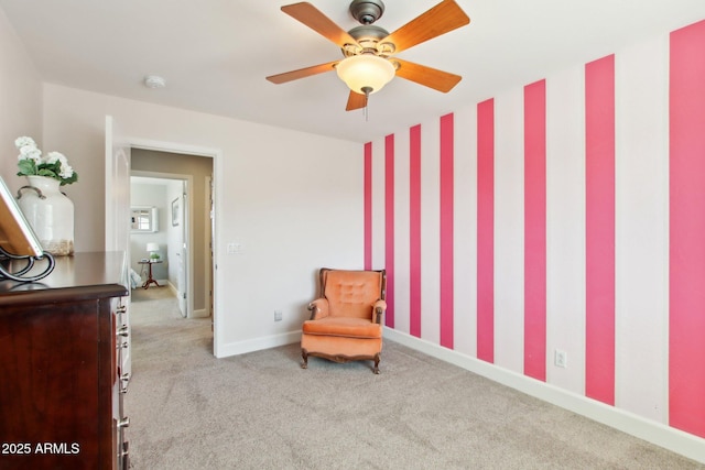 living area with carpet floors and baseboards