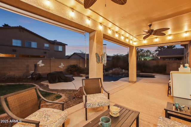 view of patio with ceiling fan and a fenced backyard