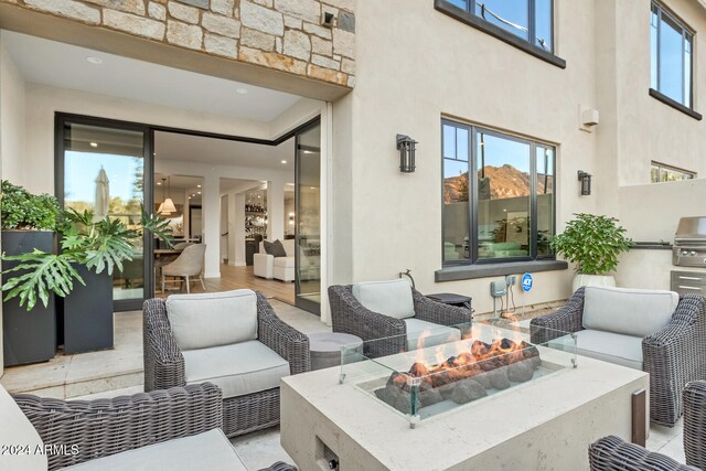 view of patio / terrace featuring a fire pit