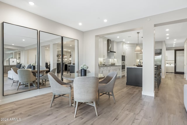 dining space featuring light hardwood / wood-style floors