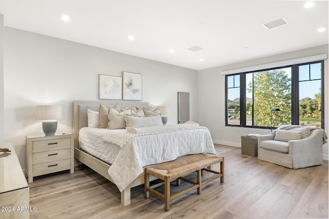 bedroom with light wood-type flooring