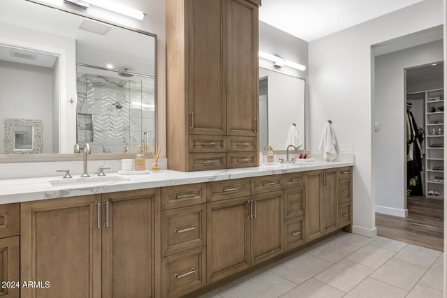 bathroom with vanity, tile patterned floors, and walk in shower