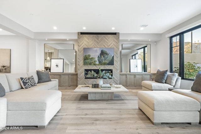 living room featuring a fireplace and light hardwood / wood-style floors