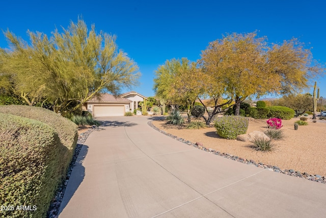 view of front of home featuring a garage and concrete driveway