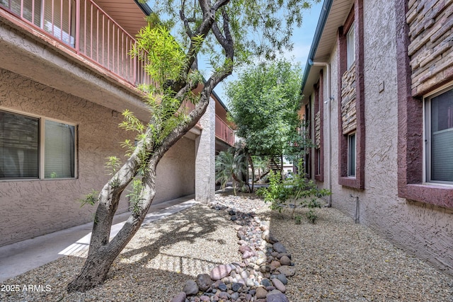view of side of home featuring stucco siding