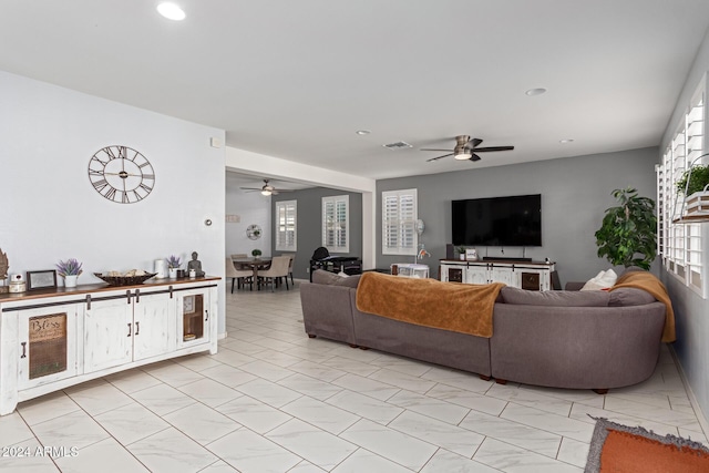 living room featuring ceiling fan