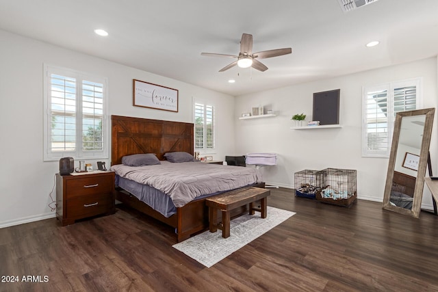 bedroom featuring ceiling fan and dark hardwood / wood-style floors