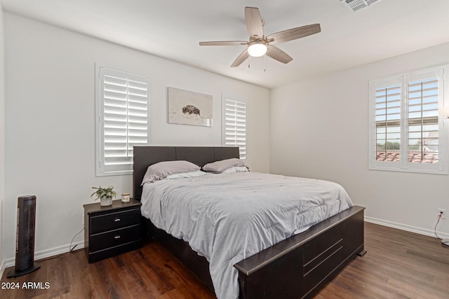 bedroom featuring dark hardwood / wood-style flooring and ceiling fan