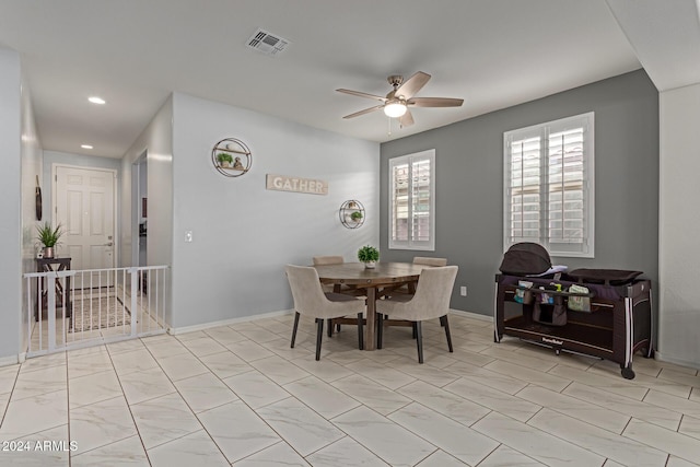 dining space featuring ceiling fan