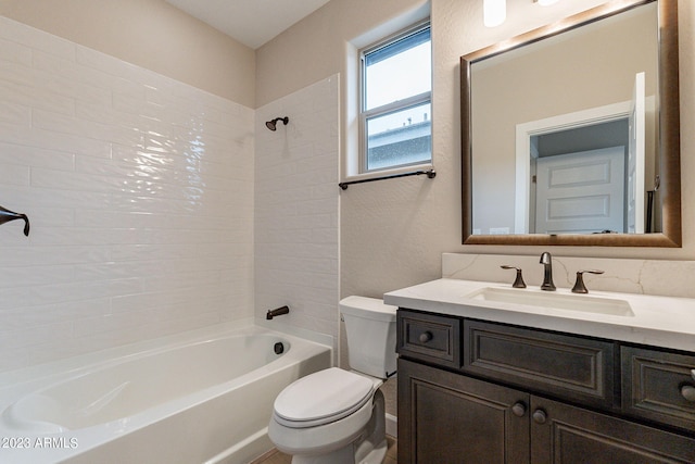 full bathroom with tiled shower / bath combo, toilet, and large vanity