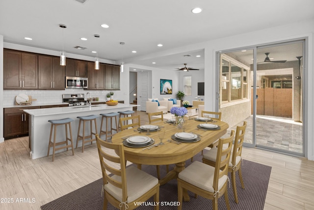 dining room featuring ceiling fan, visible vents, and recessed lighting