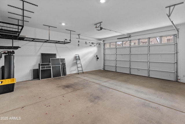 garage with baseboards and a garage door opener