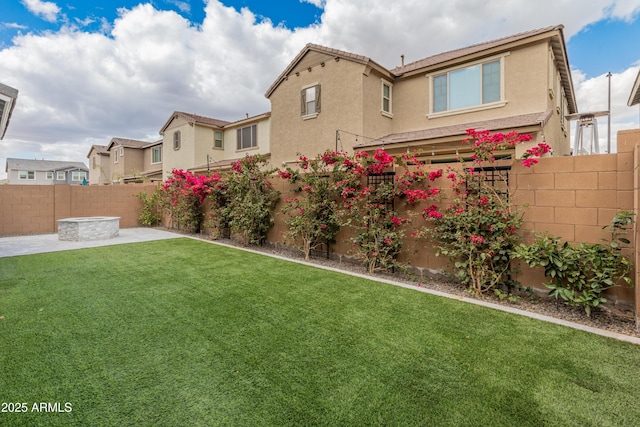 view of yard with a fenced backyard and a patio